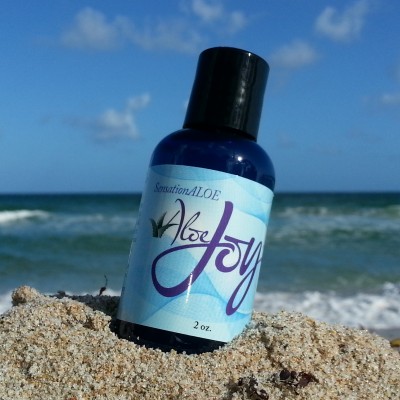 Image of Bottle of Aloe Joy on the Beach